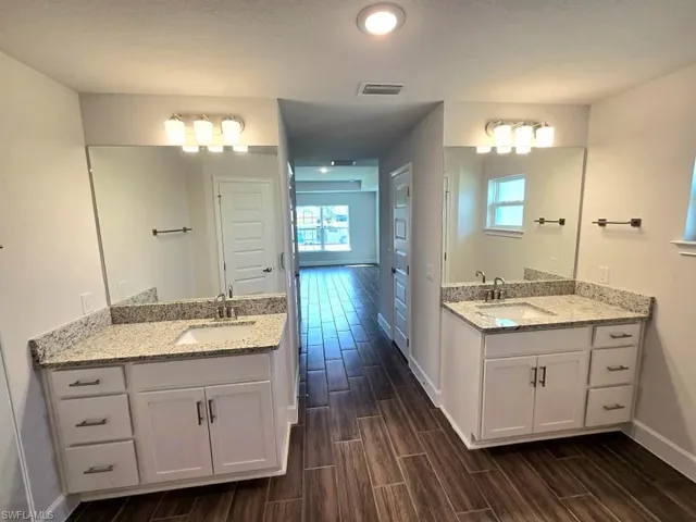 Bathroom with vanity and hardwood / wood-style flooring