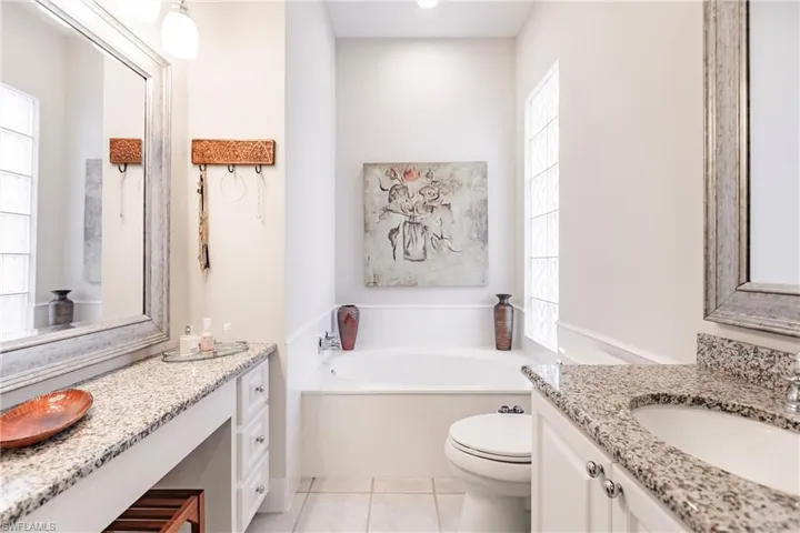 Her side of master bathroom.