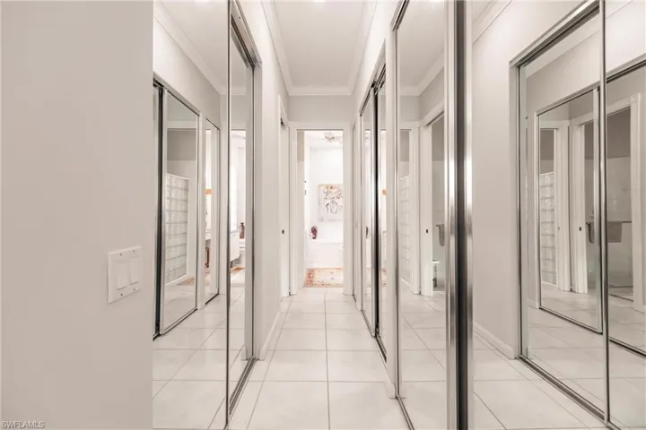 Hall of closets leads to the master bathroom.