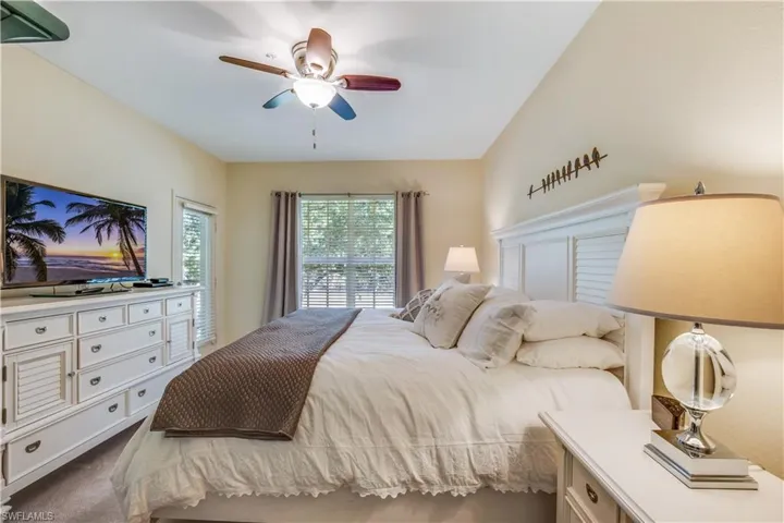 Master bedroom with door to screened lanai