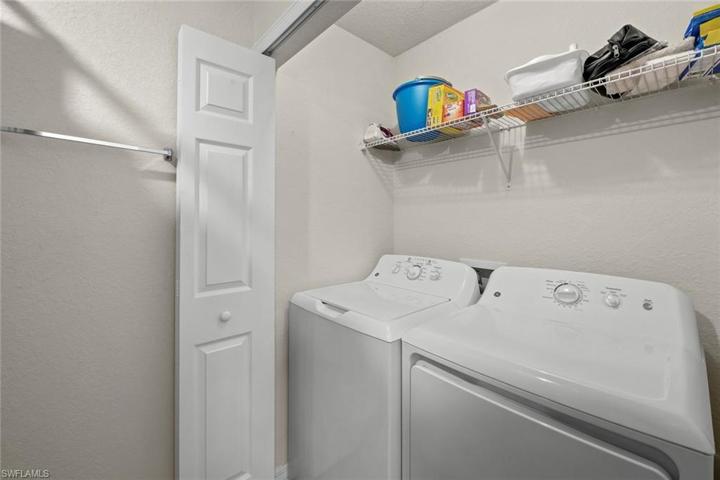 Laundry closet in guest bath