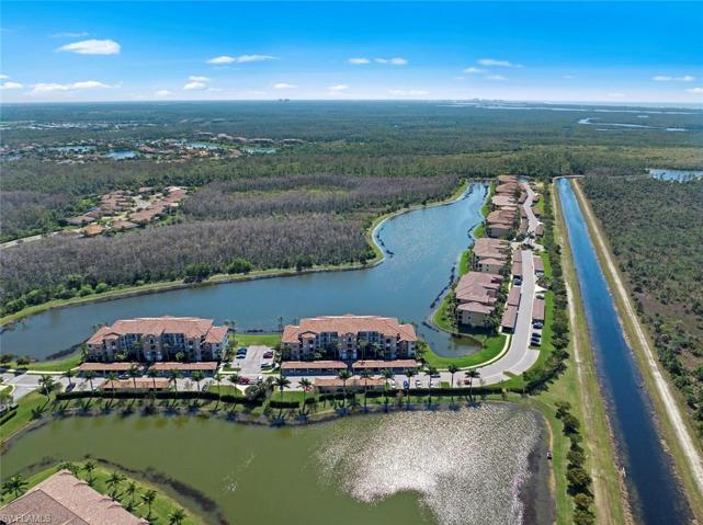 Aerial view of Trevi Condos w/Lake & Preserve behind