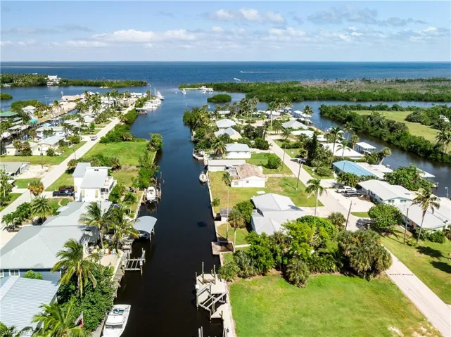 Aerial perspective of suburban area with a large body of water