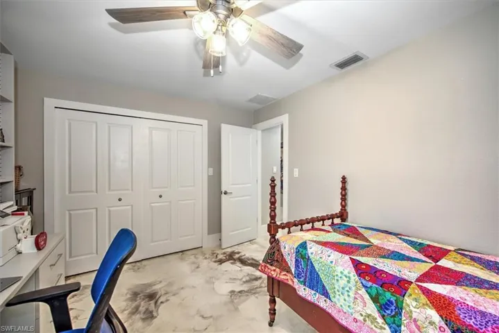 Bedroom with visible vents, a closet, and ceiling fan