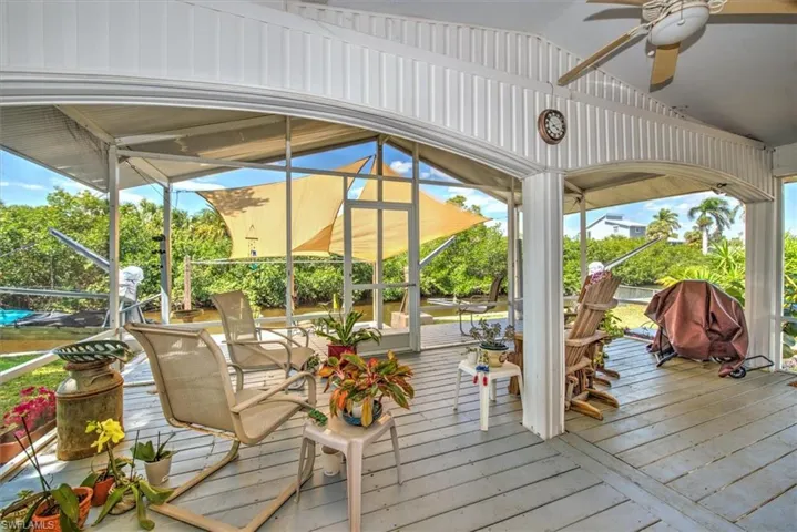 Wooden terrace with a ceiling fan