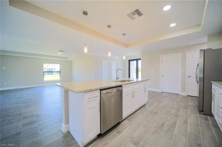 The Island Kitchen Comes With White Shaker Wood Soft Touch Cabinets And Drawers, Brushed Nickle Accents, Pending Lighting, Stainless Steel Appliances, Tile Backsplash, Granite Countertops, And A Oversized Walk-In Pantry!