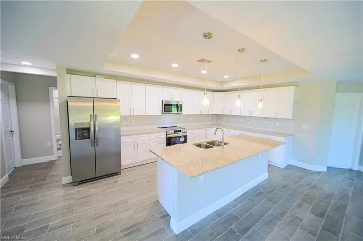 The Island Kitchen Comes With White Shaker Wood Soft Touch Cabinets And Drawers, Brushed Nickle Accents, Pending Lighting, Stainless Steel Appliances, Tile Backsplash, Granite Countertops, And A Oversized Walk-In Pantry!