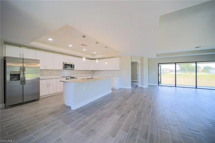 The Island Kitchen Comes With White Shaker Wood Soft Touch Cabinets And Drawers, Brushed Nickle Accents, Pending Lighting, Stainless Steel Appliances, Tile Backsplash, Granite Countertops, And A Oversized Walk-In Pantry!