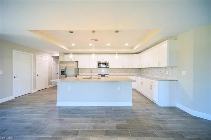 The Island Kitchen Comes With White Shaker Wood Soft Touch Cabinets And Drawers, Brushed Nickle Accents, Pending Lighting, Stainless Steel Appliances, Tile Backsplash, Granite Countertops, And A Oversized Walk-In Pantry!