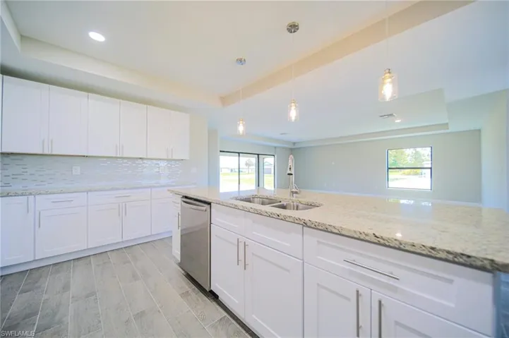 The Island Kitchen Comes With White Shaker Wood Soft Touch Cabinets And Drawers, Brushed Nickle Accents, Pending Lighting, Stainless Steel Appliances, Tile Backsplash, Granite Countertops, And A Oversized Walk-In Pantry!