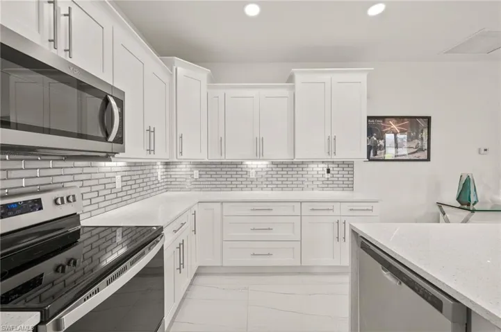 Gorgeous Kitchen with Stainless Steel Appliances and Quartz Countertops