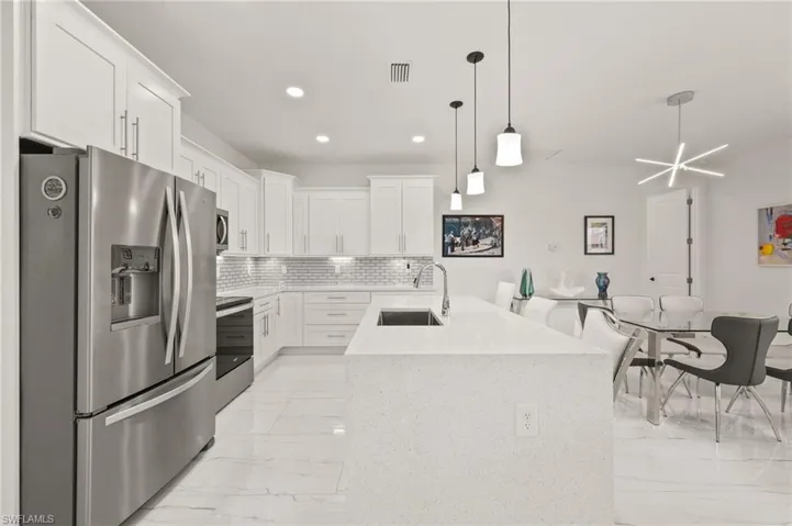 Gorgeous Kitchen with Stainless Steel Appliances and Quartz Countertops