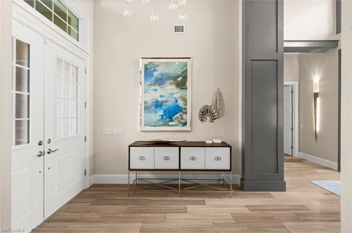 Entrance foyer featuring light wood-style flooring and baseboards