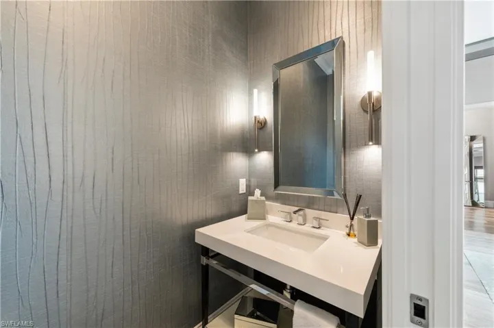 Half bath featuring a sink