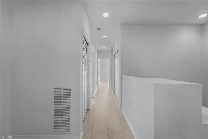 Hallway featuring light hardwood / wood-style floors