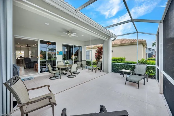 Sunroom / solarium featuring ceiling fan