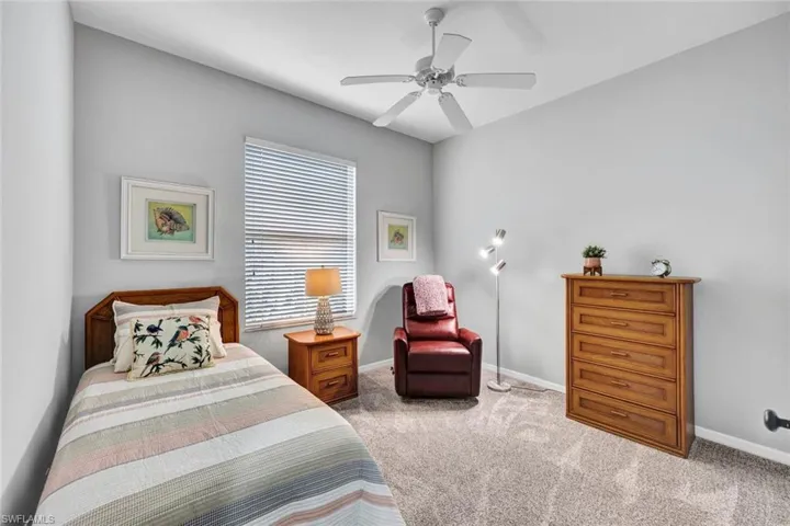 Bedroom featuring carpet and ceiling fan
