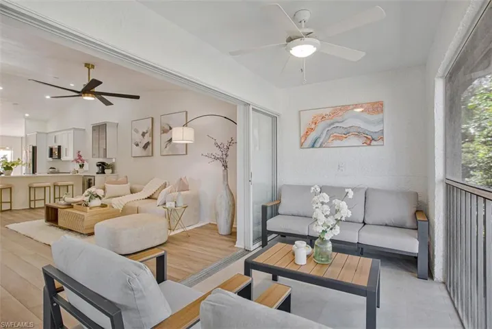 Living area featuring a ceiling fan and light wood-style flooring