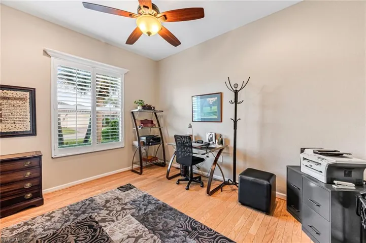 Office area featuring ceiling fan and light hardwood / wood-style flooring