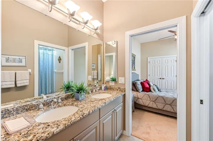 Bathroom with vanity and ceiling fan