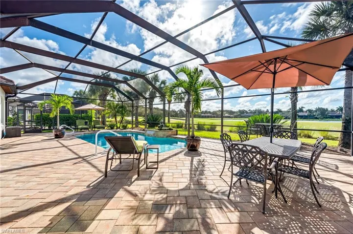 View of patio with a lanai