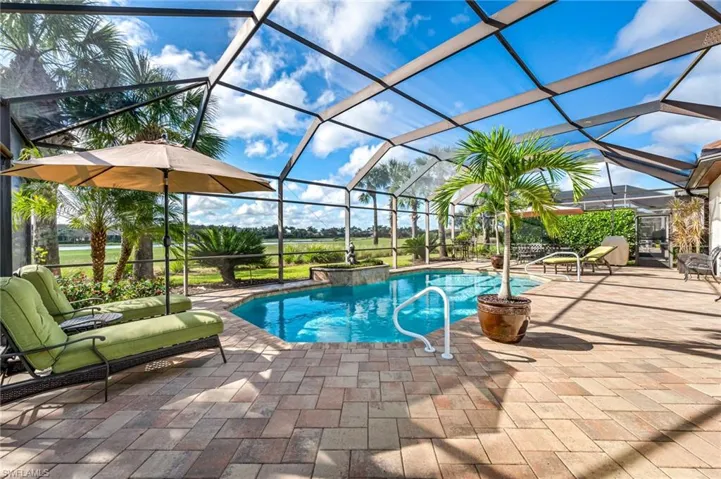 View of pool featuring a patio area and a lanai