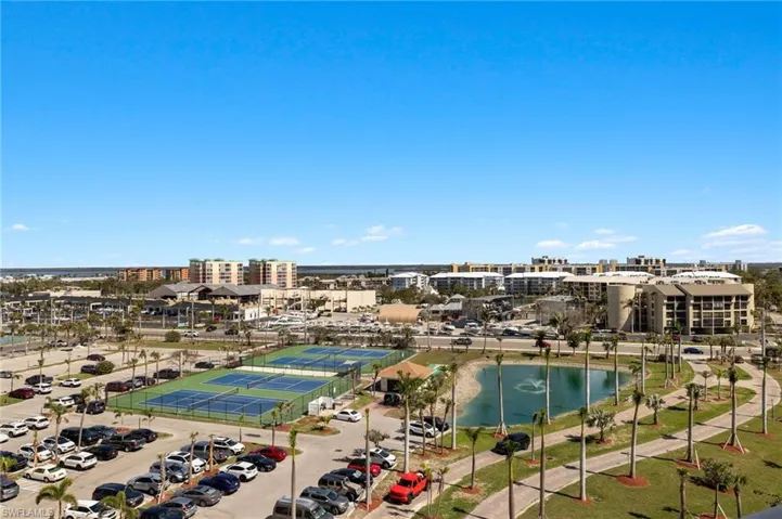 Birds eye view of property with a water view