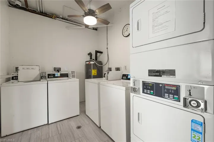 Laundry room with stacked washing maching and dryer, ceiling fan, and independent washer and dryer