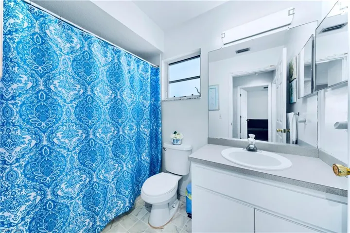 Full bath featuring toilet and vanity