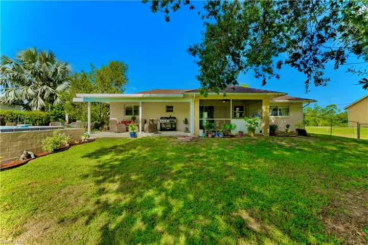 Rear view of property featuring a patio and stucco siding