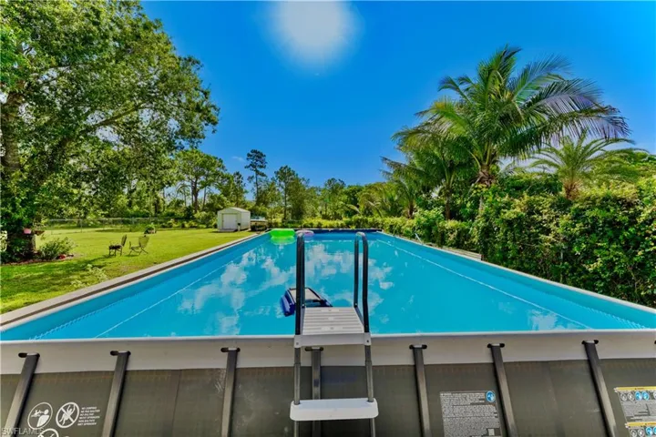Swimming pool featuring a shed
