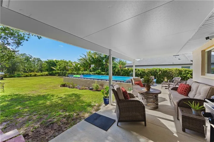 View of patio featuring outdoor lounge area and an outdoor pool