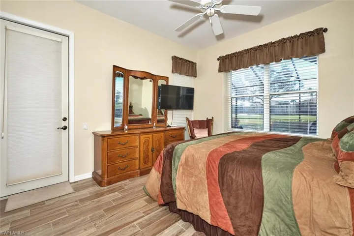 Bedroom featuring wood finish floors and ceiling fan
