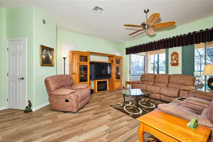 Living room featuring wood finish floors and ceiling fan