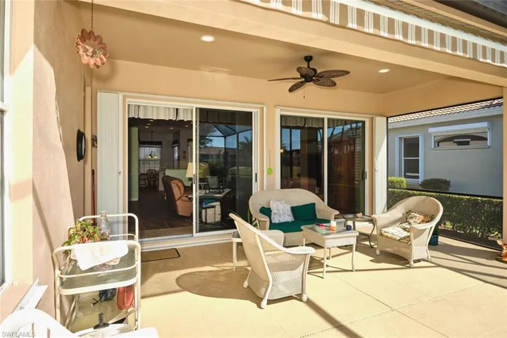 View of patio featuring ceiling fan and an outdoor living space