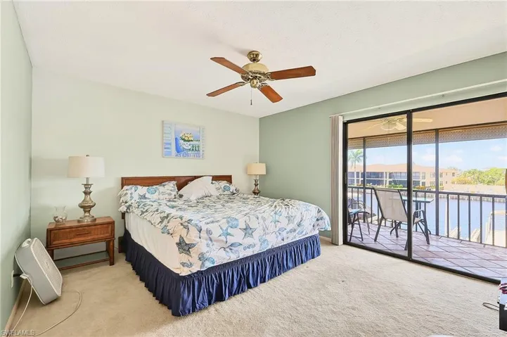 Large primary BR has a private BA attached, ceiling fan and beautiful water views