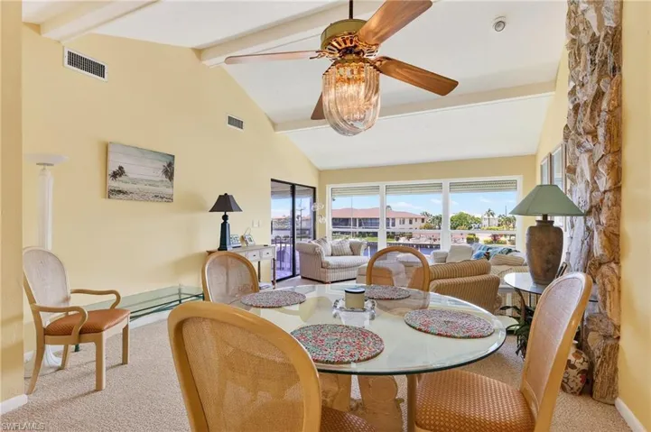 This is the dining/family room area. It is large with vaulted ceilings and tons of space