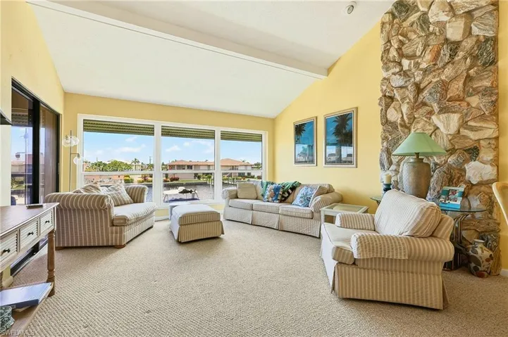 The beamed ceilings and stone wall give this area that warm inviting feel.