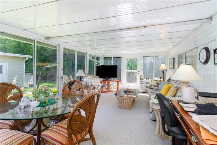 Sunroom with carpet flooring