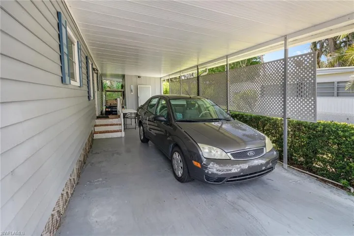 View of car parking with an attached carport