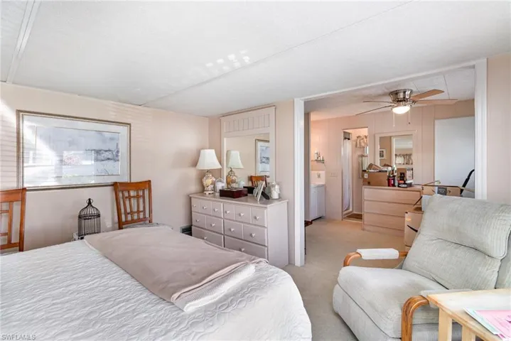 Bedroom with light carpet