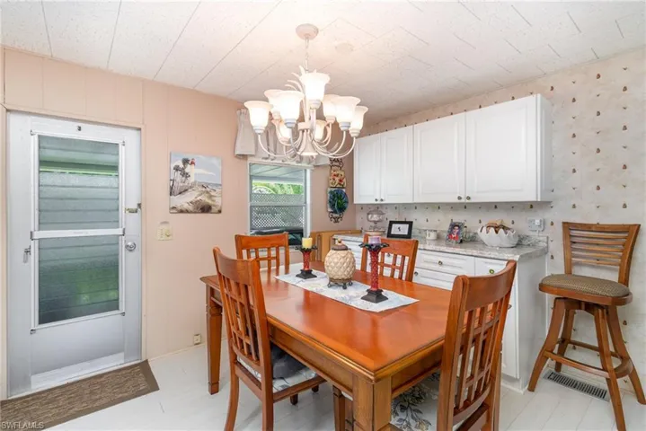 Dining room featuring a chandelier and light wood finished floors