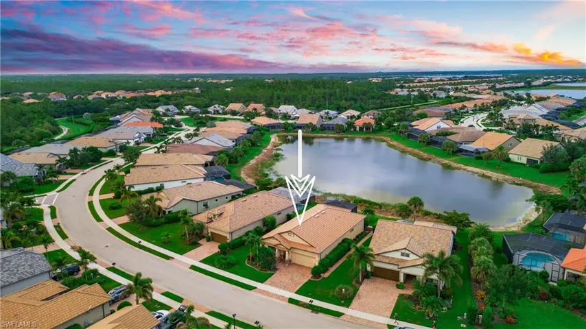 Aerial view at dusk of a residential view and a water view
