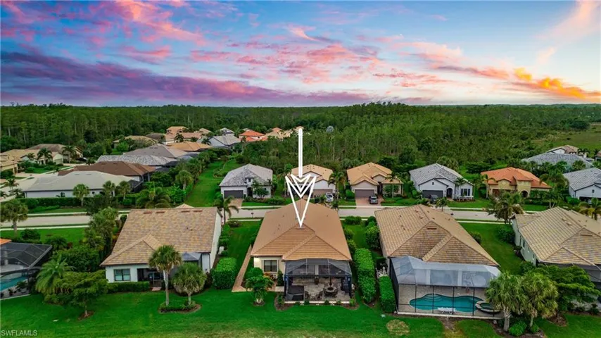 Aerial view at dusk of a residential view and a forest view