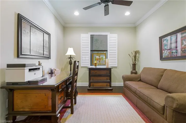 Office featuring wood finished floors, a ceiling fan, ornamental molding, and recessed lighting
