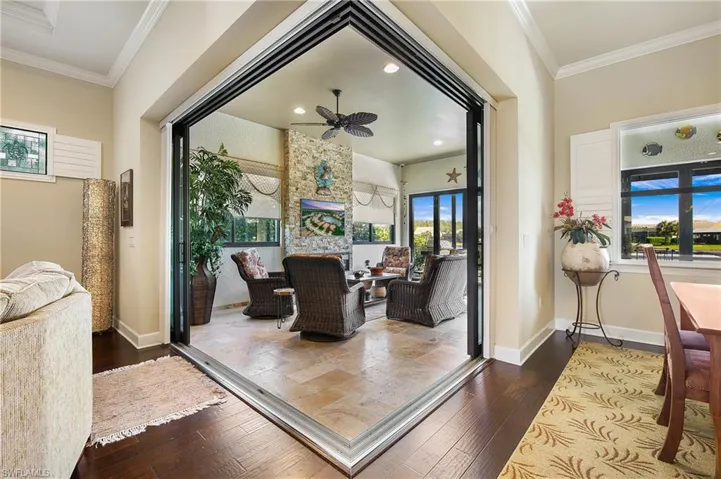 Sun Room featuring hardwood / wood-style floors, ornamental molding, ceiling fan, and recessed lighting