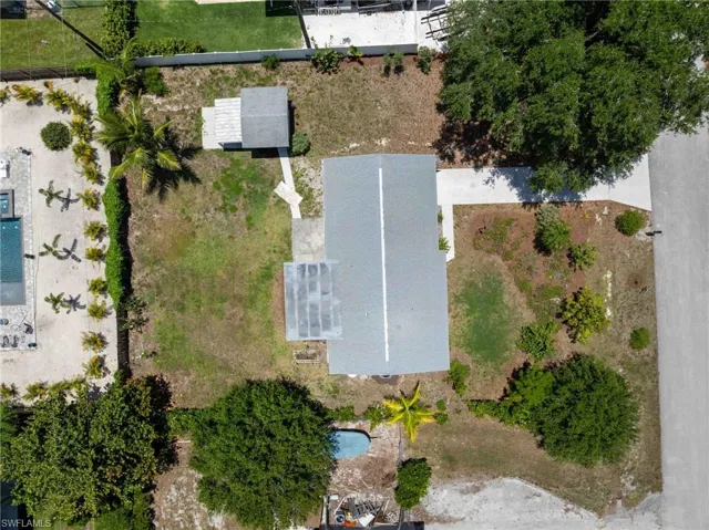 Aerial view of property and surrounding area with a pool area