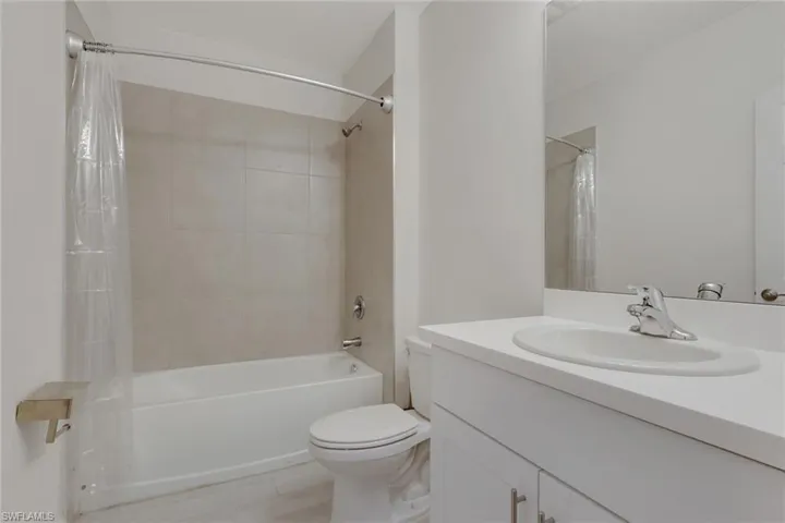 Full bathroom with vanity and shower / tub combo