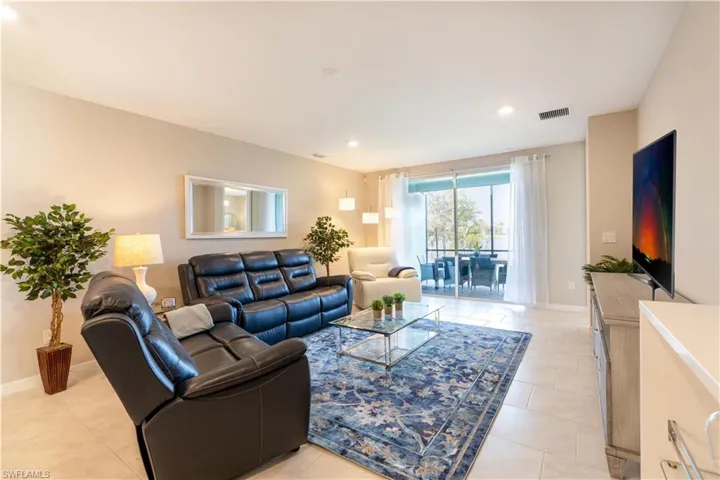 Living room featuring light tile patterned floors