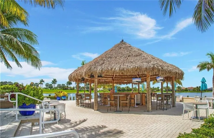 View of home's community with a gazebo, an outdoor bar, and a water view